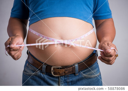 Overweight or fat adult man in very tight jeans 58878086