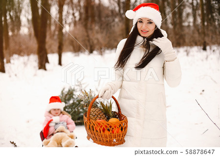 Mother and daughter in a winter park Mother and daughter in a winter park 58878647