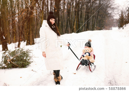 Mother and daughter in a winter park Mother and daughter in a winter park 58878866
