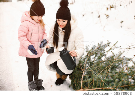 Mother and daughter in a winter park Mother and daughter in a winter park 58878908