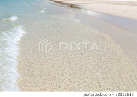 Blue sea waves summer background. Sand beach 58881617