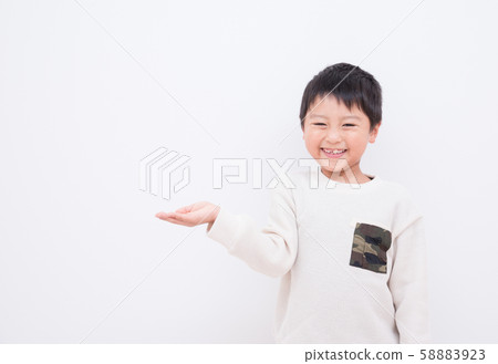 Children pointing with a smile 58883923