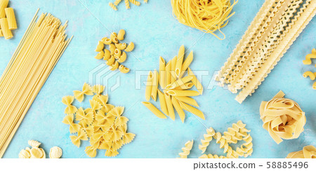 A panorama of Italian pasta types, flat lay banner, top shot on a blue background 58885496