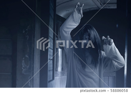 Scary ghost woman with blood and angry face 58886058