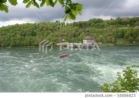Waterfall Rhine Falls (Rheinfall) at Schaffhausen in Switzerland. The largest waterfall in Europe Waterfall Rhine Falls (Rheinfall) at Schaffhausen in Switzerland. The largest waterfall in Europe 58886823