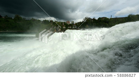 Waterfall Rhine Falls (Rheinfall) at Schaffhausen in Switzerland. The largest waterfall in Europe Waterfall Rhine Falls (Rheinfall) at Schaffhausen in Switzerland. The largest waterfall in Europe 58886827