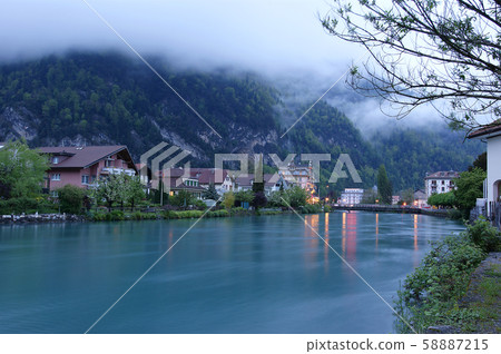 Switzerland, Interlaken. Evening view of a small river in the downtown Switzerland, Interlaken. Evening view of a small river in the downtown 58887215