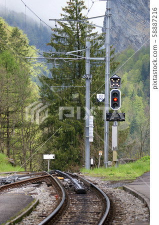Switzerland, Alps, rails and railway semaphore highlands railroad in the woods Switzerland, Alps, rails and railway semaphore highlands railroad in the woods 58887216