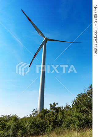Renewable energy - Wind turbine above the hill 58887446