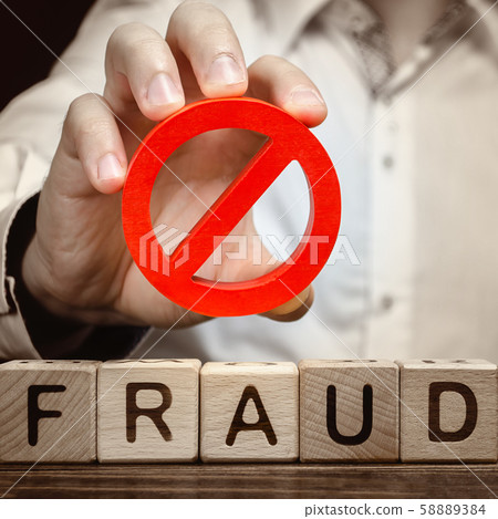 A man holds a red NO prohibition symbol over word fraud. Countering deception, protection against fraudsters. The fight corruption, financial pyramids and business scams. War on crime. Cheaters A man holds a red NO prohibition symbol over word fraud. Countering deception, protection against fraudsters. The fight corruption, financial pyramids and business scams. War on crime. Cheaters 58889384