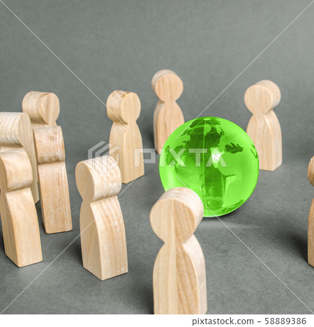 People surrounded a green Globe world planet earth. Cooperation and collaboration of people around the world. Outsourcing and joint work on projects. Diplomacy. crowdfunding. Preserving environment People surrounded a green Globe world planet earth. Cooperation and collaboration of people around the world. Outsourcing and joint work on projects. Diplomacy. crowdfunding. Preserving environment 58889386