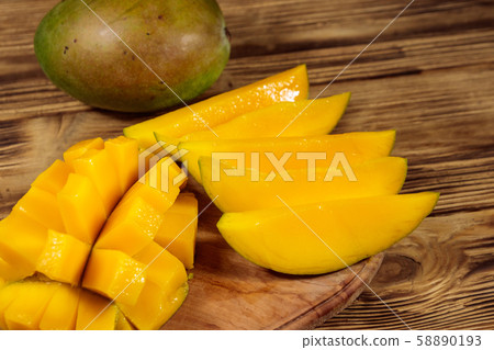 Fresh mango fruit on wooden table Fresh mango fruit on wooden table 58890193
