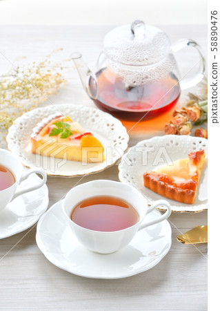 An image of tea and fruit tart tea time. 58890476