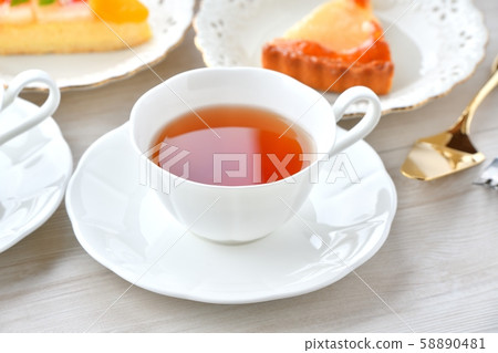 An image of tea and fruit tart tea time. 58890481