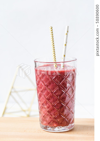 Red beet, blueberry and strawberry smoothie in a 58890600