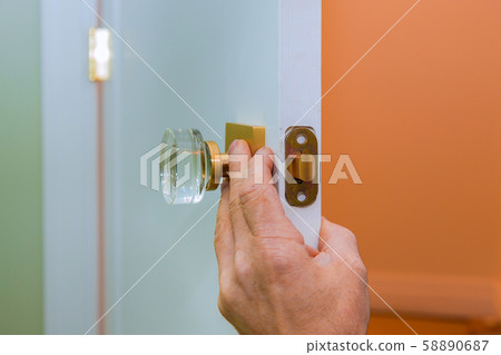 Builder in installing a door lock the door of a 58890687