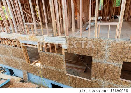 Exterior framing of new house under construction Exterior framing of new house under construction 58890688