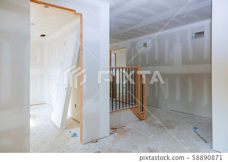 Finishing putty in the room walls plasterboards Finishing putty in the room walls plasterboards 58890871