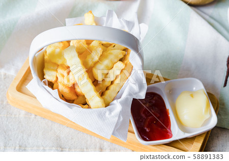 French fries and tomato dipping sauce. French fries and tomato dipping sauce. 58891383