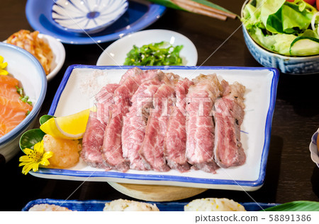 Sliced grilled Strip Loin rare degree of ripeness Sliced grilled Strip Loin rare degree of ripeness 58891386