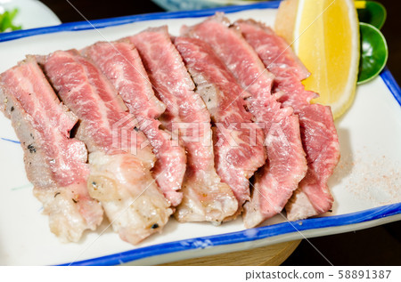 Sliced grilled Strip Loin rare degree of ripeness Sliced grilled Strip Loin rare degree of ripeness 58891387