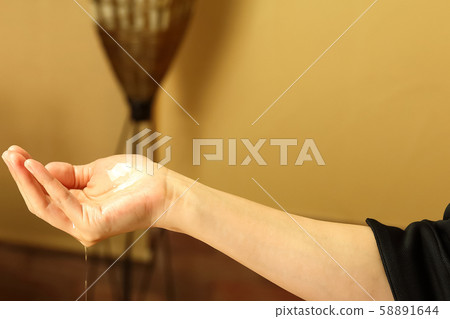 Ayurvedic esthetician hand 58891644