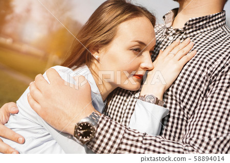 Romantic couple in the autumn park - love, relationship and dating concept 58894014