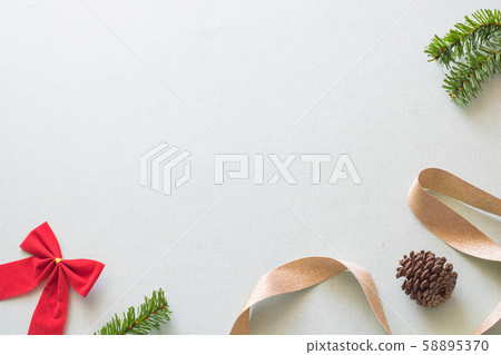 Christmas background with gift boxes, pine cone and decorations on light blue background. Preparation for holidays. Top view with copy space. 58895370