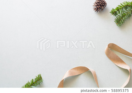 Christmas background with gift boxes, pine cone and decorations on light blue background. Preparation for holidays. Top view with copy space. 58895375