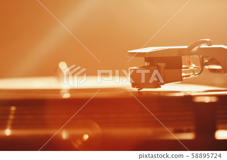 Close up of turntable needle on a vinyl record. Close up of turntable needle on a vinyl record. 58895724