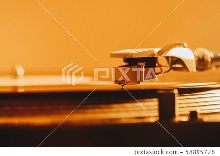 Close up of turntable needle on a vinyl record. 58895728