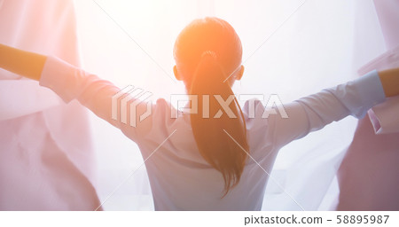 businesswoman opening curtain 58895987
