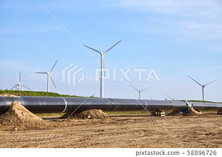 Pipeline construction site on a sunny day. Pipeline construction site on a sunny day. 58896726