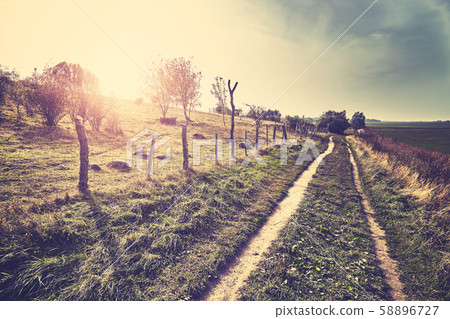 Scenic country road at sunset. Scenic country road at sunset. 58896727