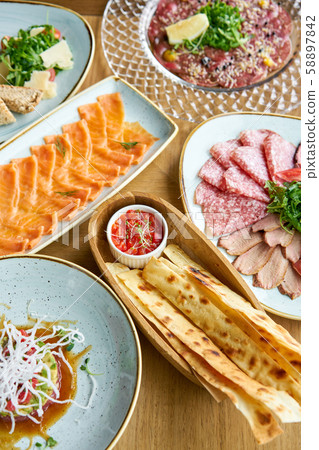 Matzo. Served with tomato and sweet pepper chutney. Variety of dishes on the table. Various snacks Matzo. Served with tomato and sweet pepper chutney. Variety of dishes on the table. Various snacks 58897842