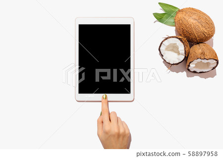 Woman's hand touching tablet device 58897958