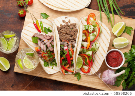 Mexican tacos and caipirinha cocktail Mexican tacos and caipirinha cocktail 58898266