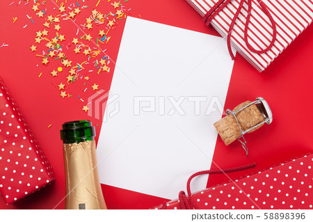Champagne, blank card and gift boxes Champagne, blank card and gift boxes 58898396