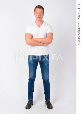 Full body shot of young handsome man with arms crossed 58902185