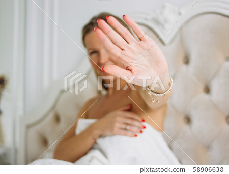 Happy smiling beautiful long hair young woman ulling hand towards camera 58906638