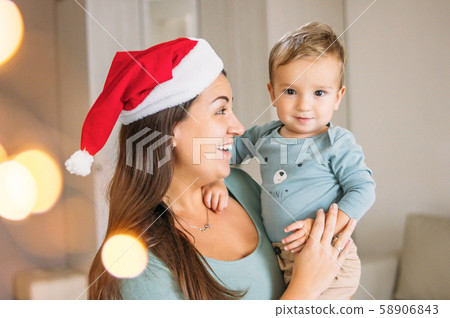 Charming little baby boy with mom brunette woman Charming little baby boy with mom brunette woman 58906843