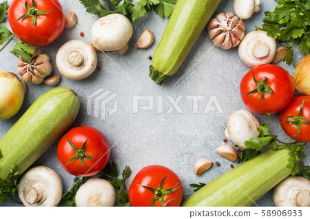 Set of different seasonal vegetables on a gray Set of different seasonal vegetables on a gray 58906933