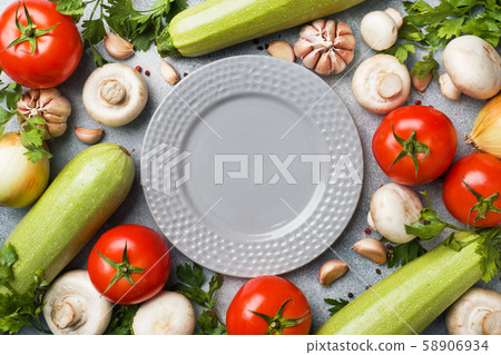 Set of different seasonal vegetables on a gray Set of different seasonal vegetables on a gray 58906934