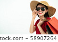 Beautiful Asian girl holding shopping bags enjoy 58907264