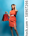 Beautiful Asian girl holding shopping bags enjoy 58907266