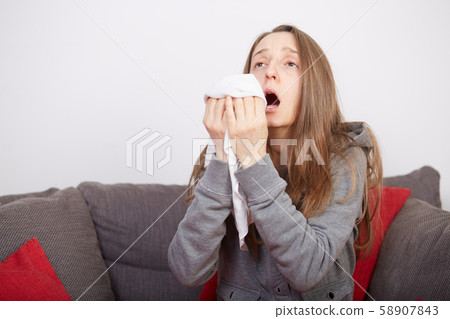 young woman with flu 58907843