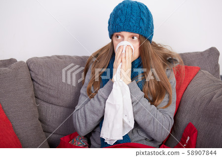 young woman with flu 58907844