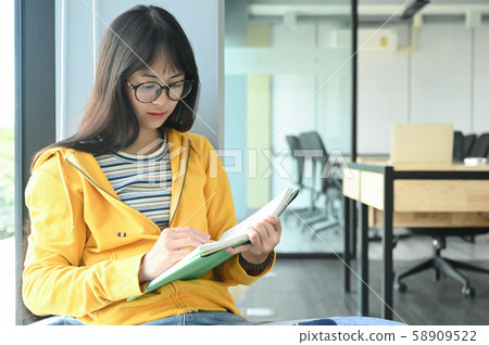Asian female students are reading books to prepare for university entrance exams. Asian female students are reading books to prepare for university entrance exams. 58909522