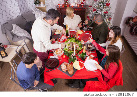 Top view of beautiful family celebrating christmas together Top view of beautiful family celebrating christmas together 58911067