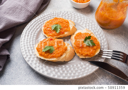 Sandwiches with bread zucchini caviar tomatoes onions. Homemade vegetarian food. Copy space. Sandwiches with bread zucchini caviar tomatoes onions. Homemade vegetarian food. Copy space. 58911359